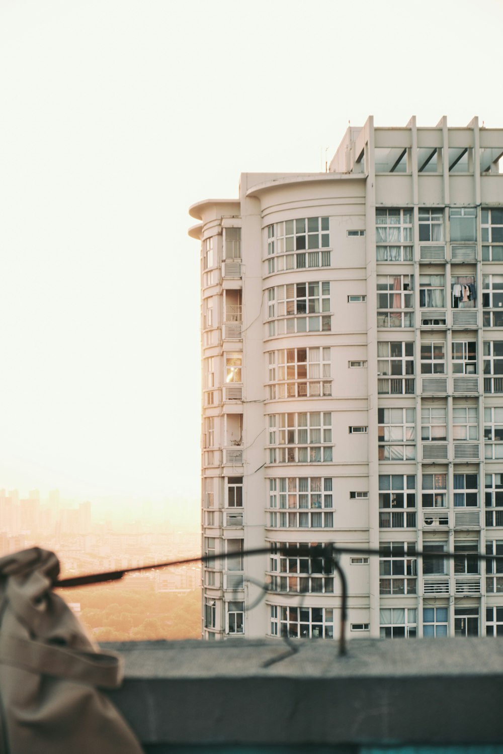 a view of a tall building from a rooftop