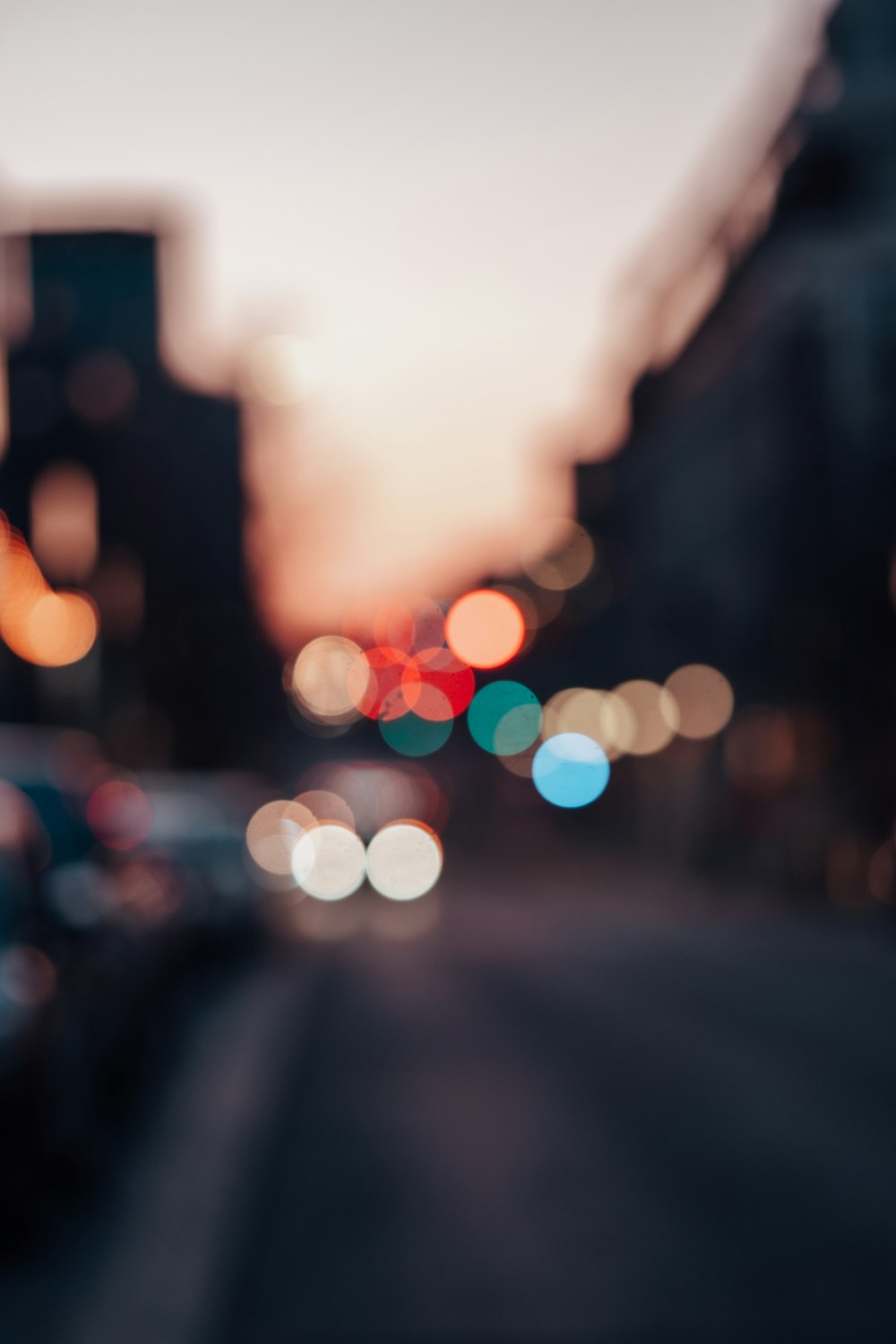 a blurry photo of a city street at night