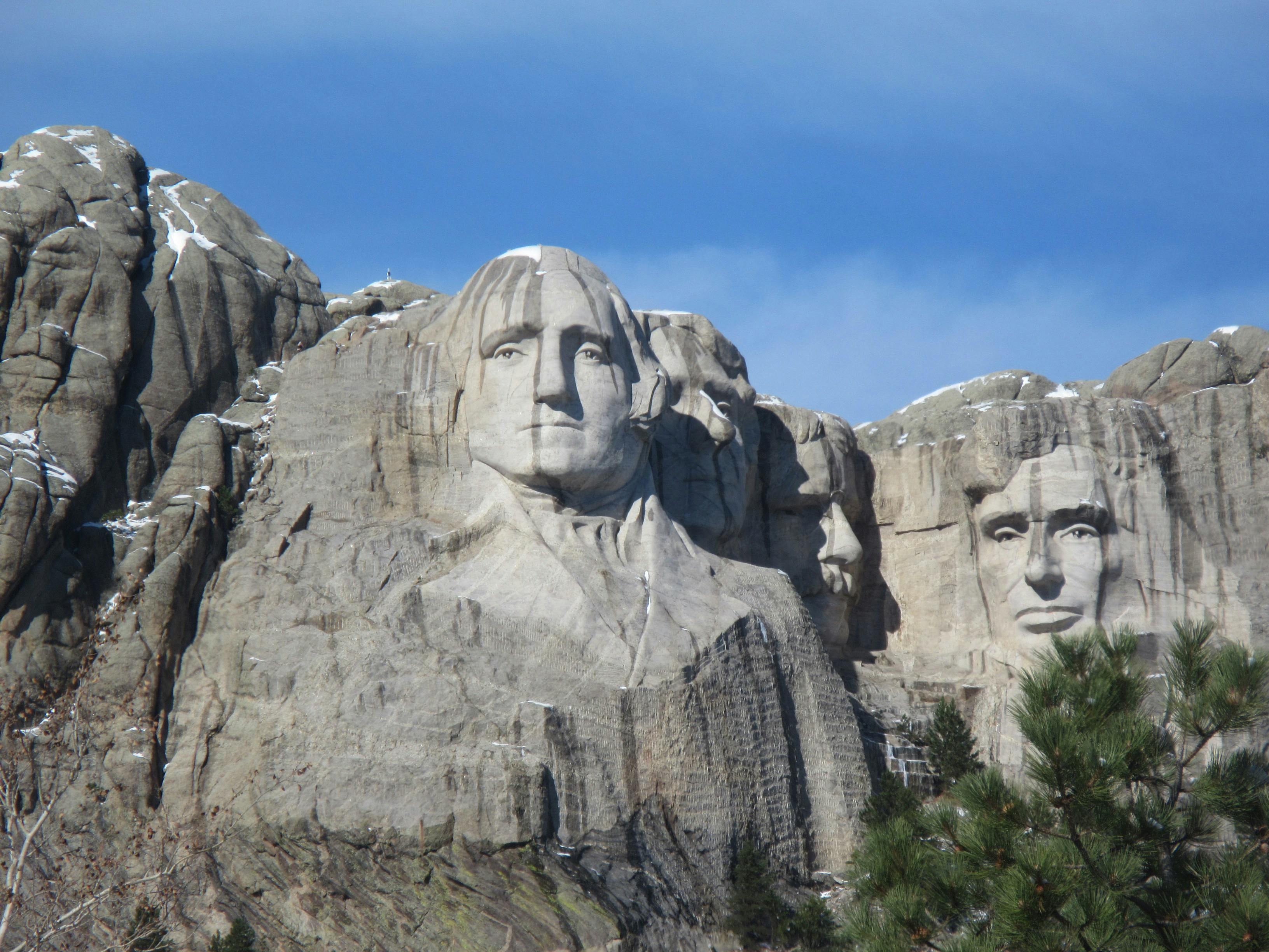 a group of presidents carved into the side of a mountain