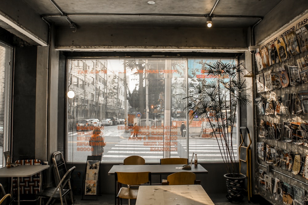 a restaurant with a large window and a view of the street