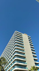 A high-rise commercial building in Kerala with freshly applied waterproof coating on its exterior walls.