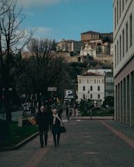 Couple exploring a historic European city with guided tours.