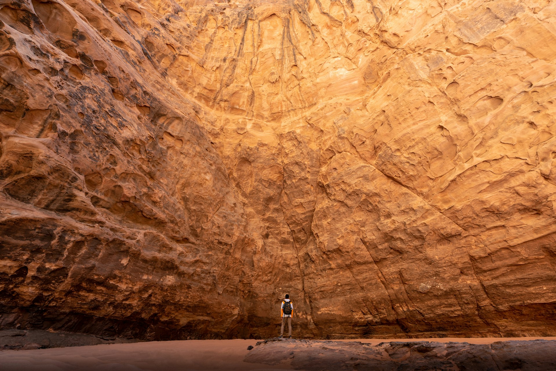 a man standing in the middle of a canyon
