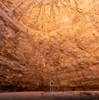 a man standing in the middle of a canyon