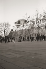 A vibrant photo of a diverse group of skateboarders riding together on a sunny urban street, showcasing various skateboard styles.