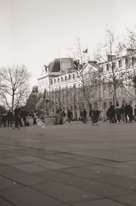 A vibrant photo of a diverse group of skateboarders riding together on a sunny urban street, showcasing various skateboard styles.