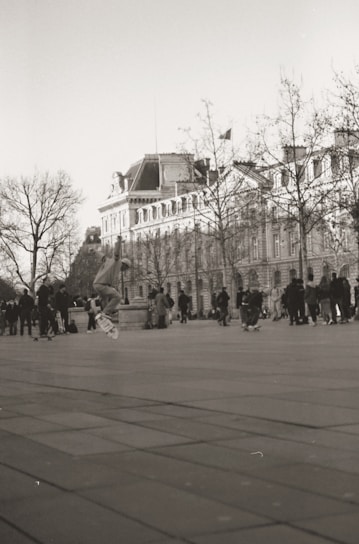 A vibrant photo of a diverse group of skaters enjoying the city streets with Bridgerna LLC skateboards and gear.