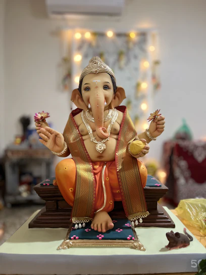 A finely crafted brass Lakshmi idol seated on a lotus, radiating warmth and grace.