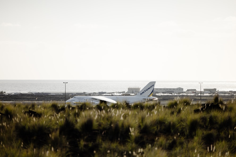 a large jetliner sitting on top of an airport runway