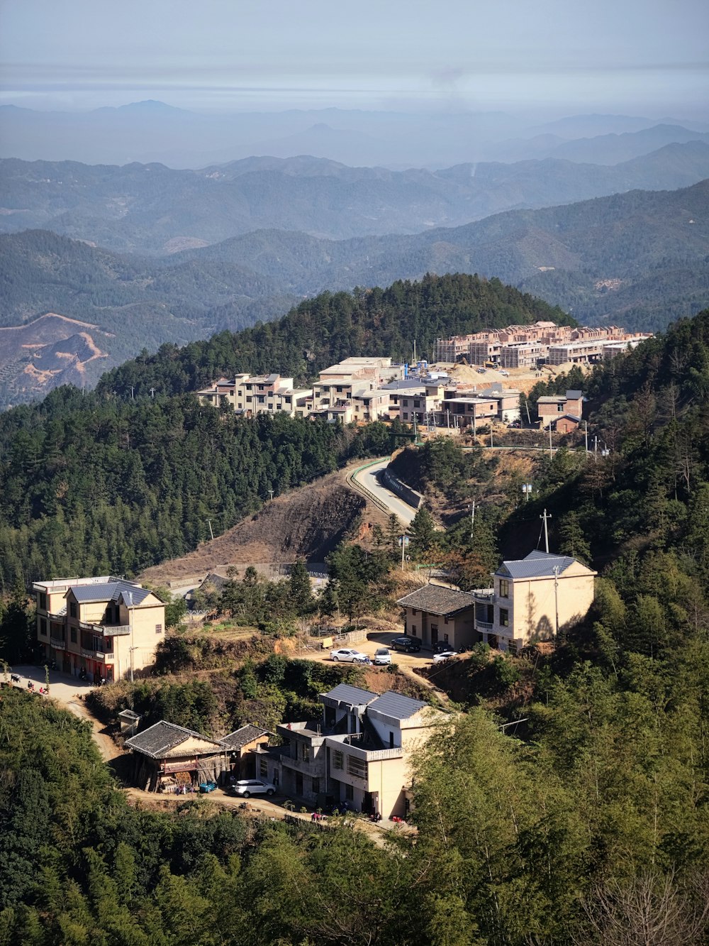 a view of a town in the mountains