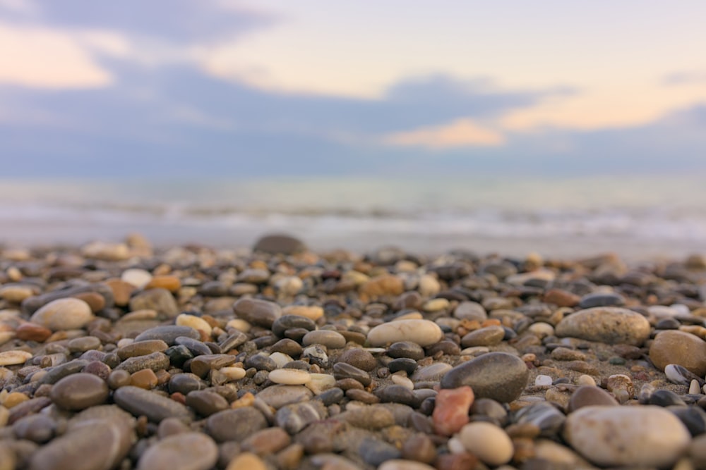 a beach covered in lots of rocks and pebbles