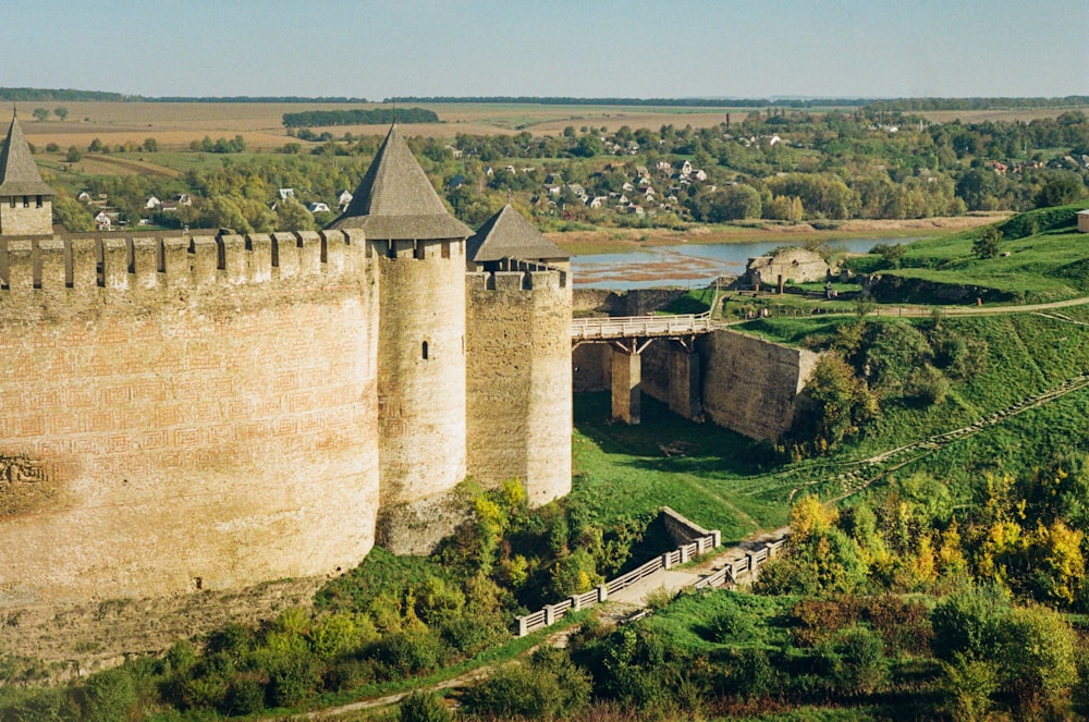 a castle with a bridge going over the top of it