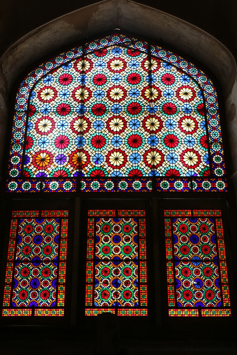 a large stained glass window in a building