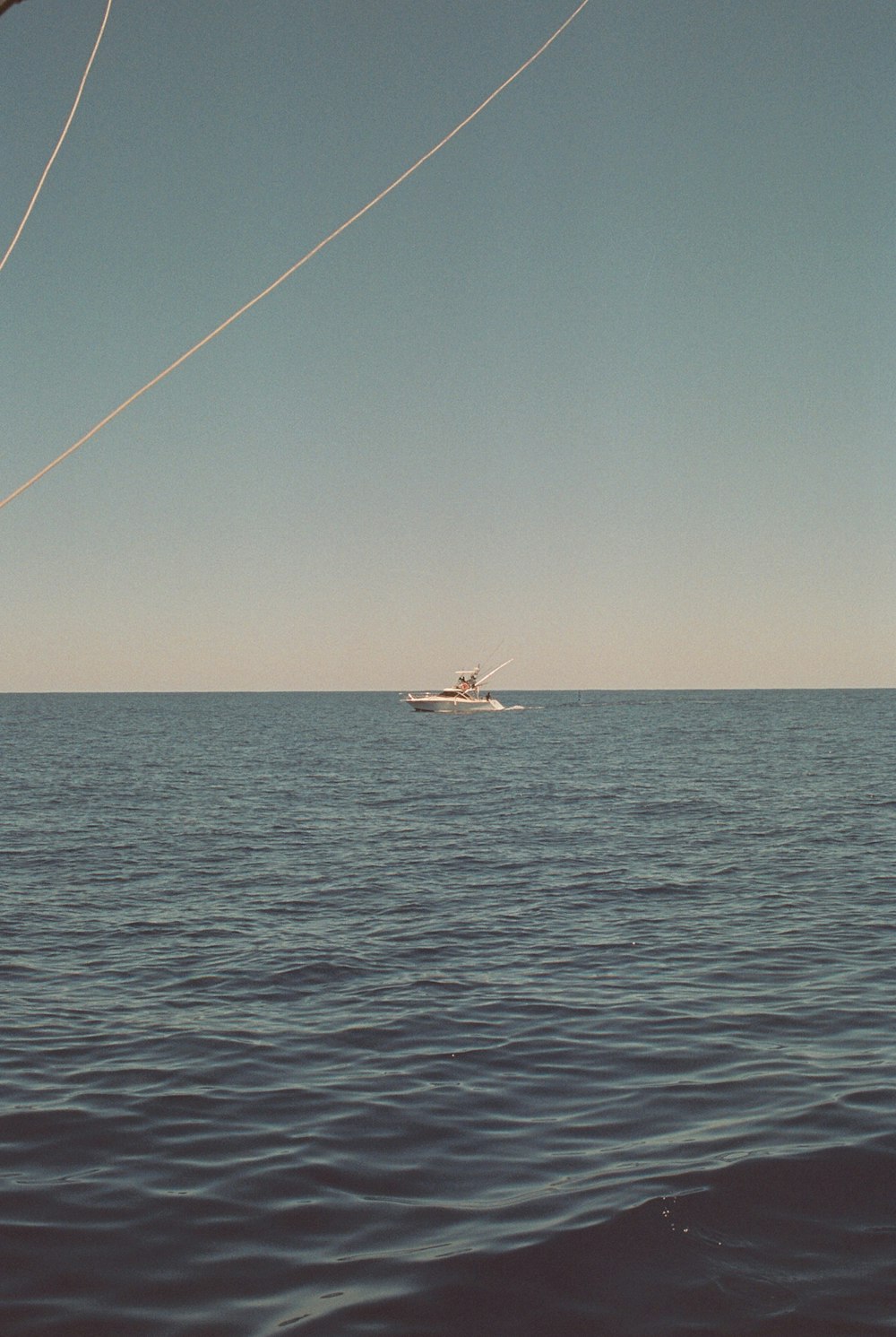 a boat in the middle of a large body of water