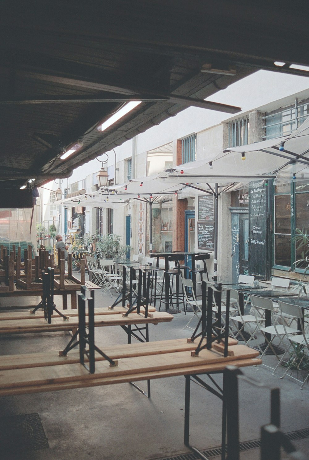 a row of wooden benches sitting next to each other