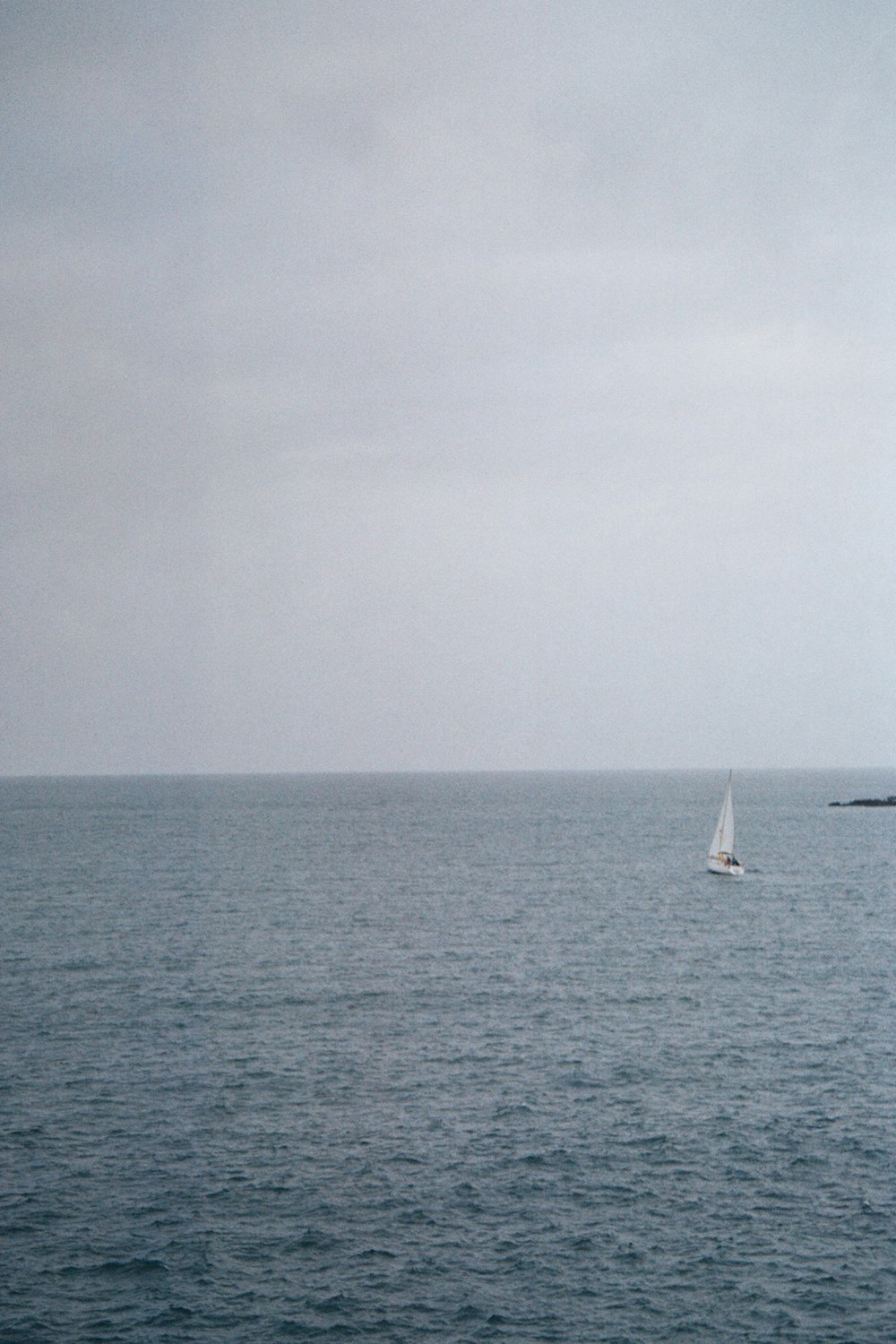 a sailboat in the middle of a large body of water