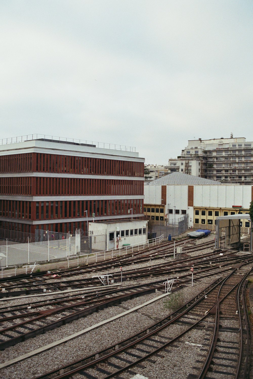 a train track with a building in the background