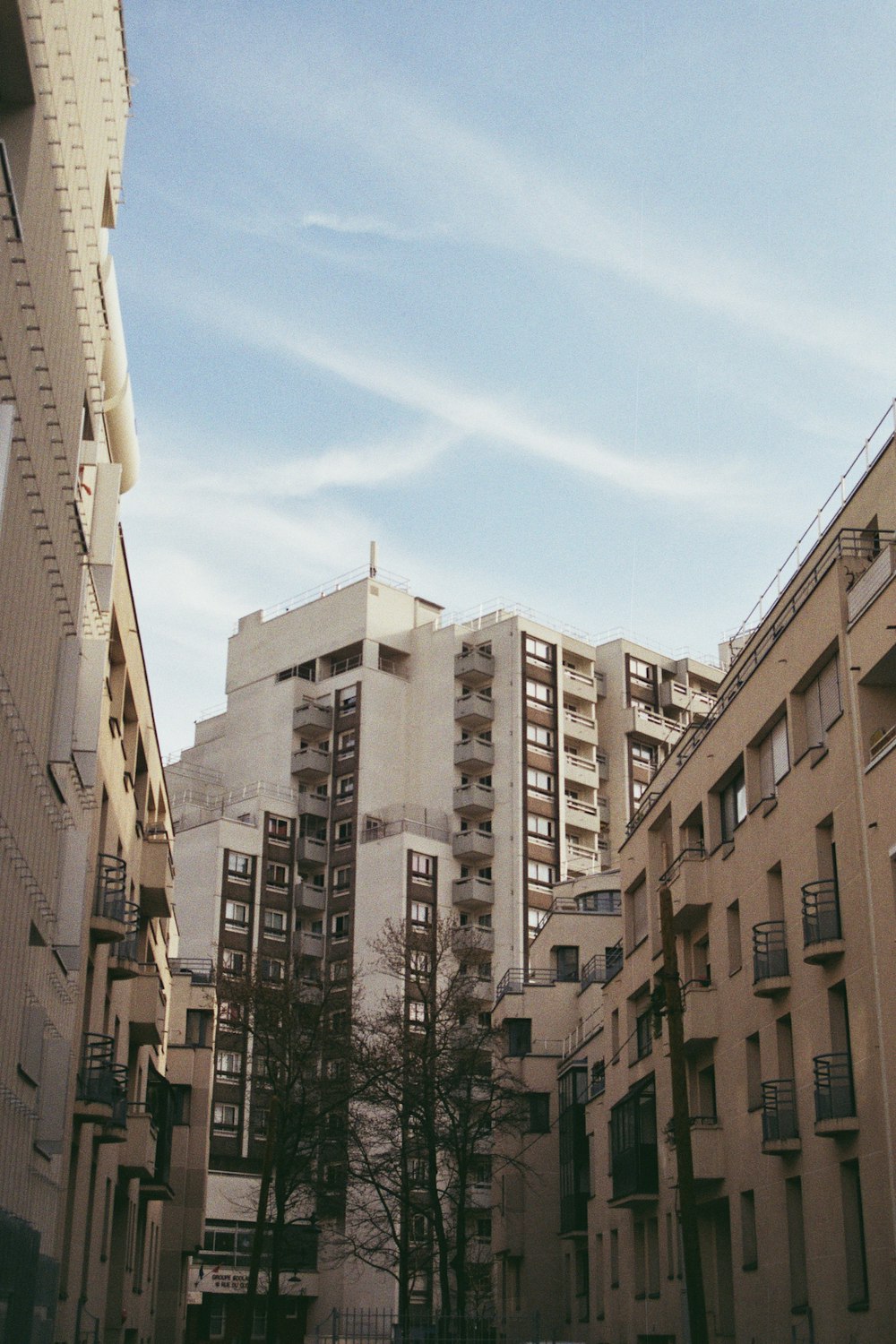 a couple of tall buildings sitting next to each other