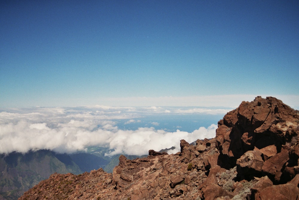 a person standing on top of a rocky mountain