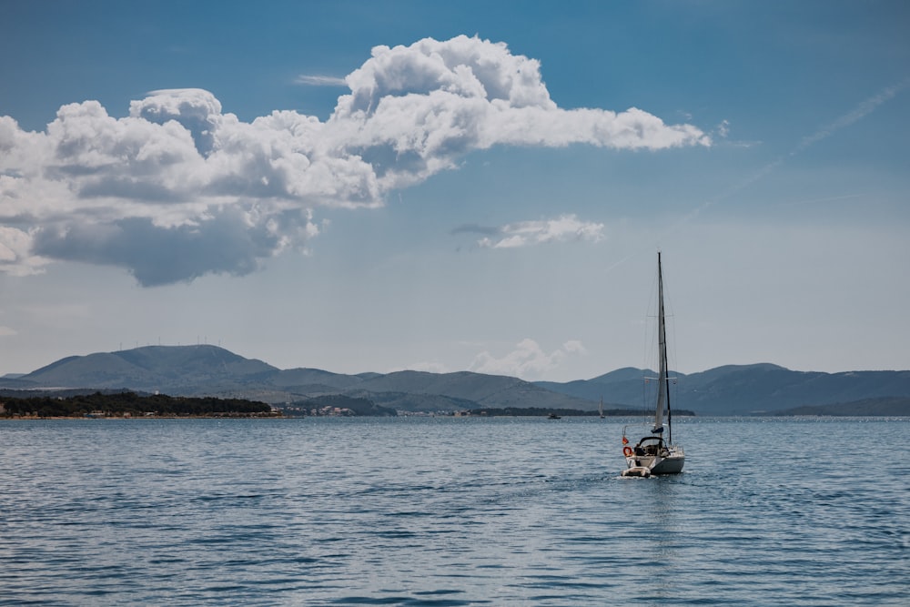 a sailboat in the middle of a large body of water