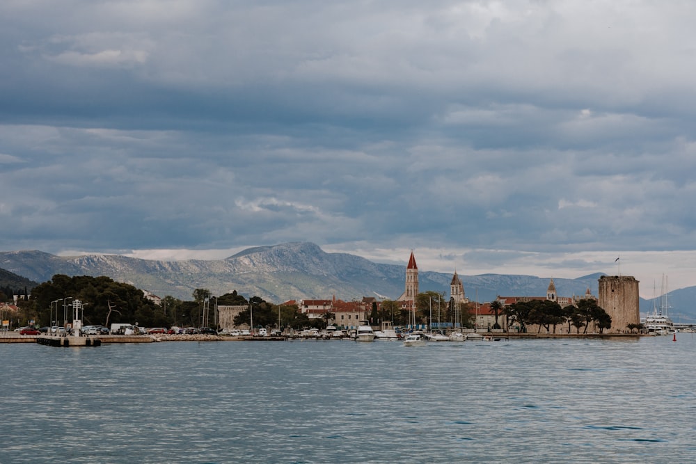 a large body of water with a city in the background