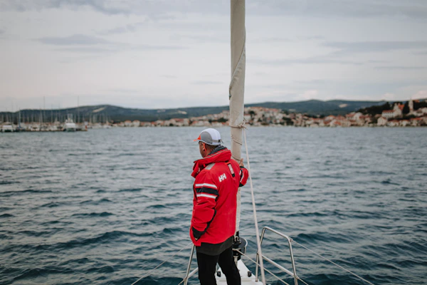 Man in marine jacket on a boat