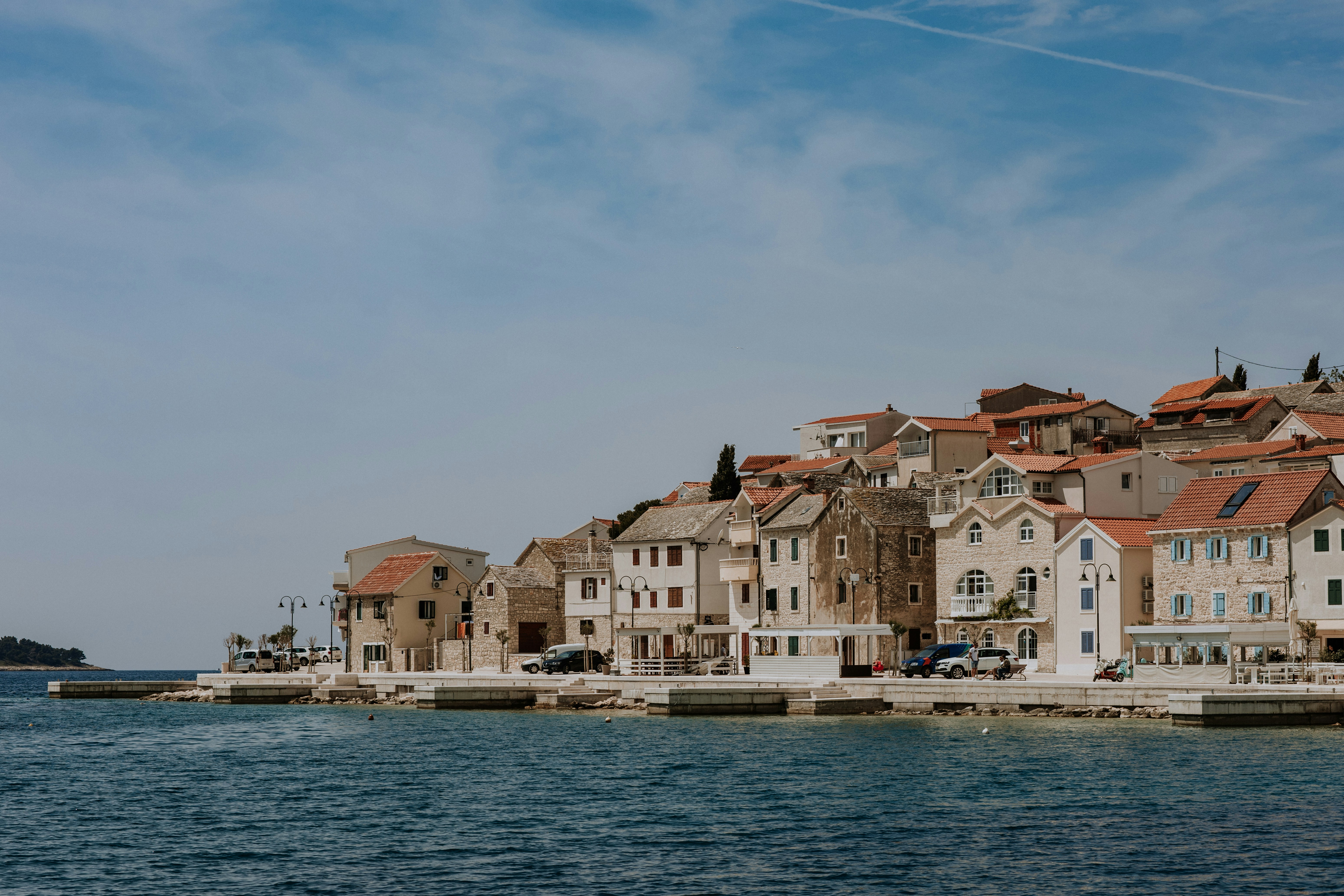 a row of houses next to a body of water