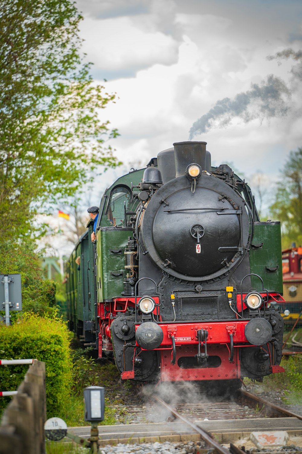 a steam engine train traveling down train tracks