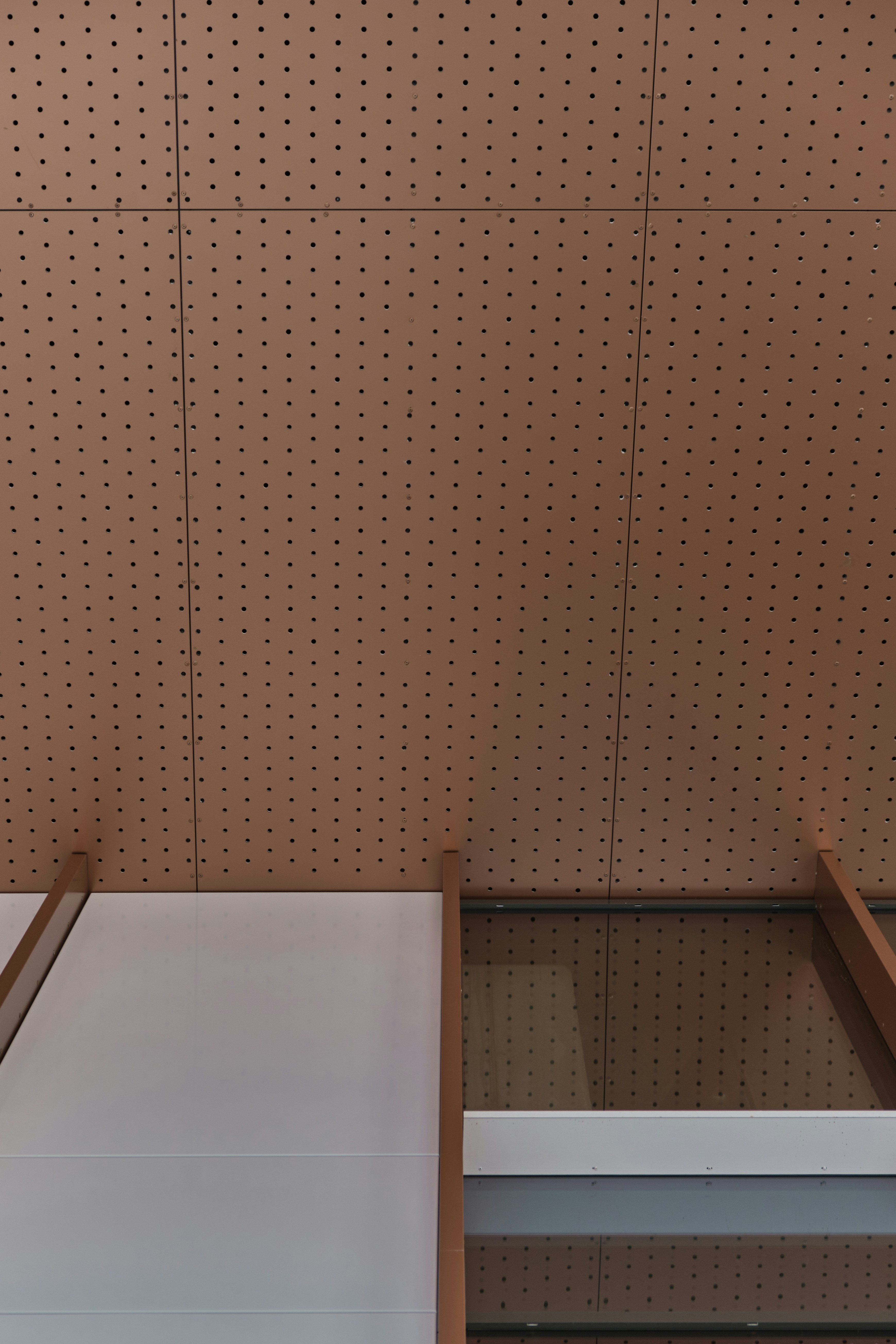 a room with a bed and a shelf in it