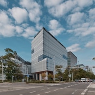 The exterior of the mdf enterprises office building on a bright sunny day.