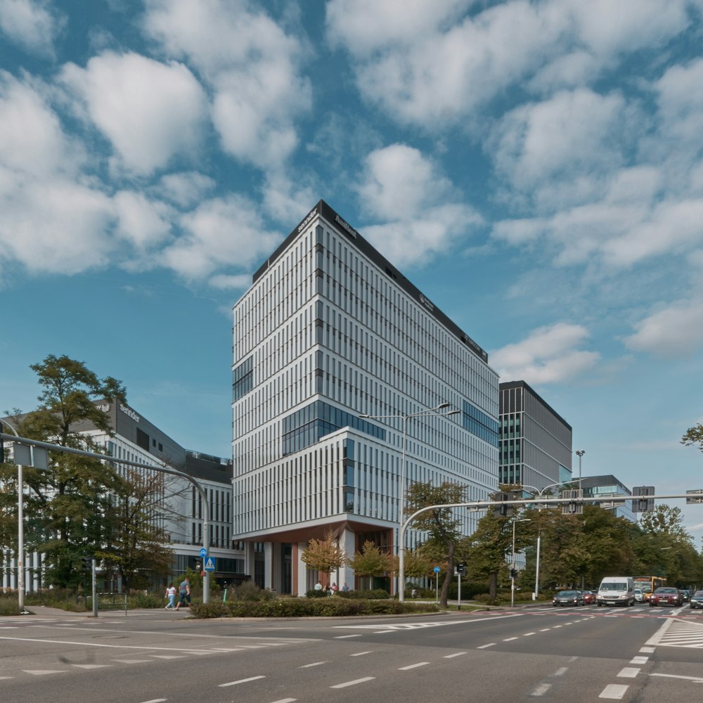 a very tall building sitting on the side of a road