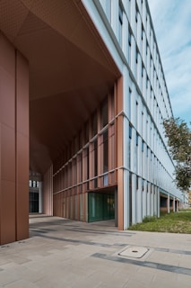 Institutional building exterior featuring sleek structural elements and a welcoming entrance.