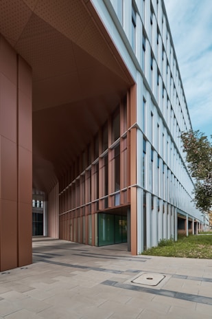 Institutional building exterior featuring sleek structural elements and a welcoming entrance.