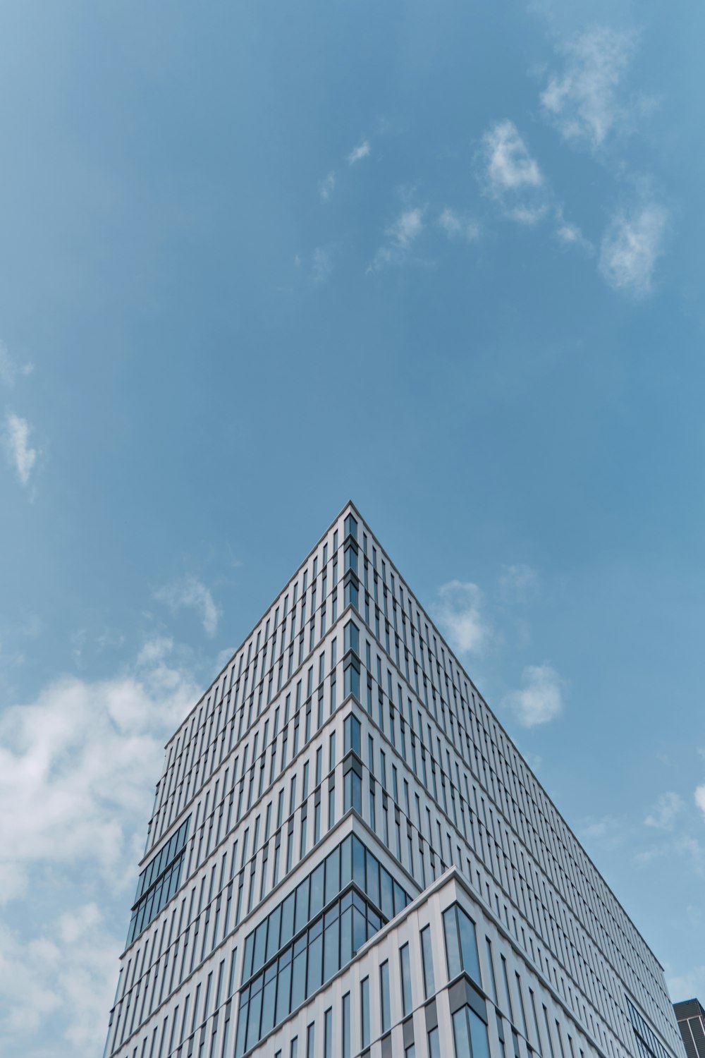 a very tall building with a sky background