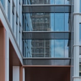 Exterior 3D rendering of a commercial building with glass facade.