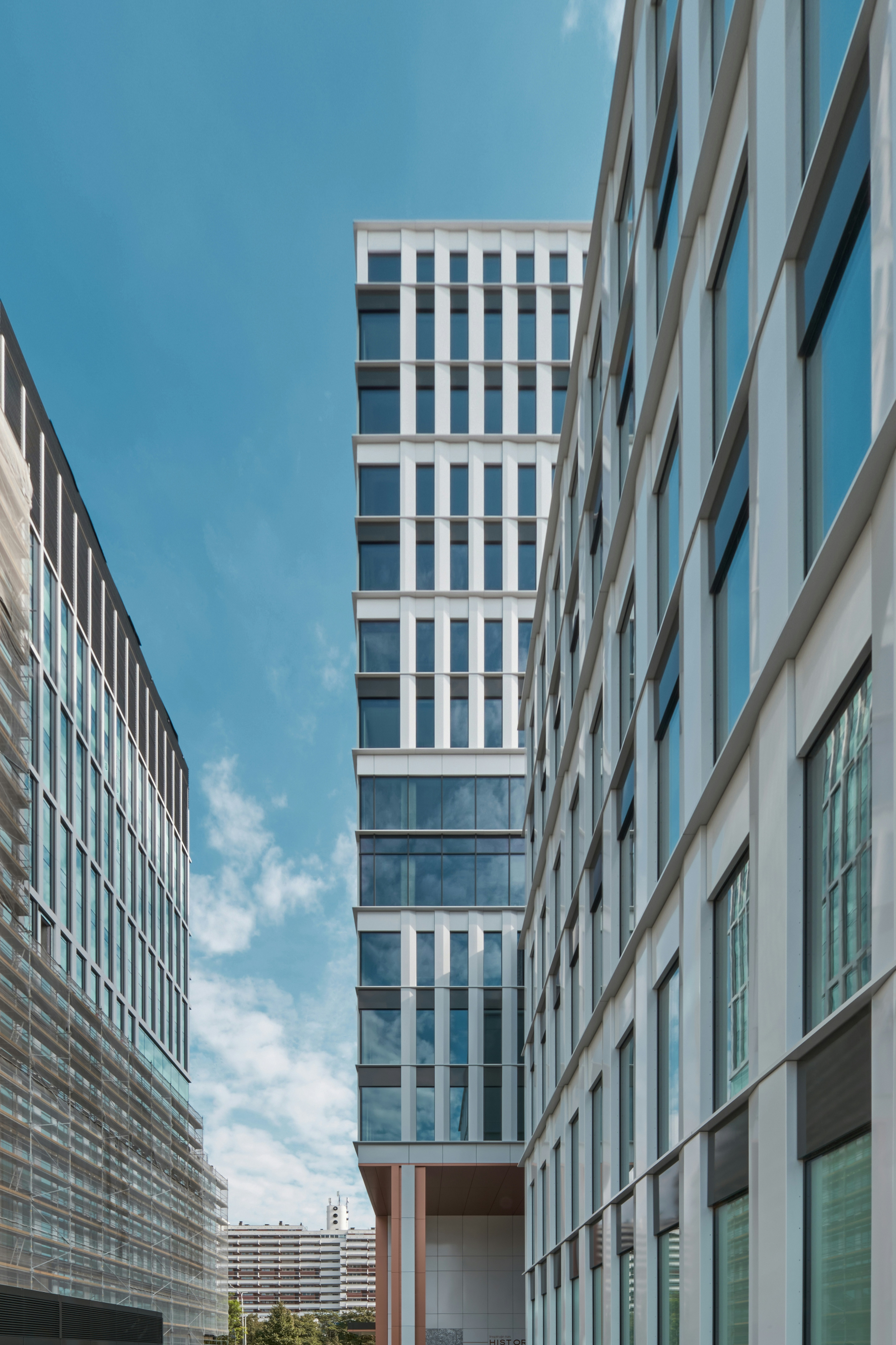 a couple of tall buildings sitting next to each other