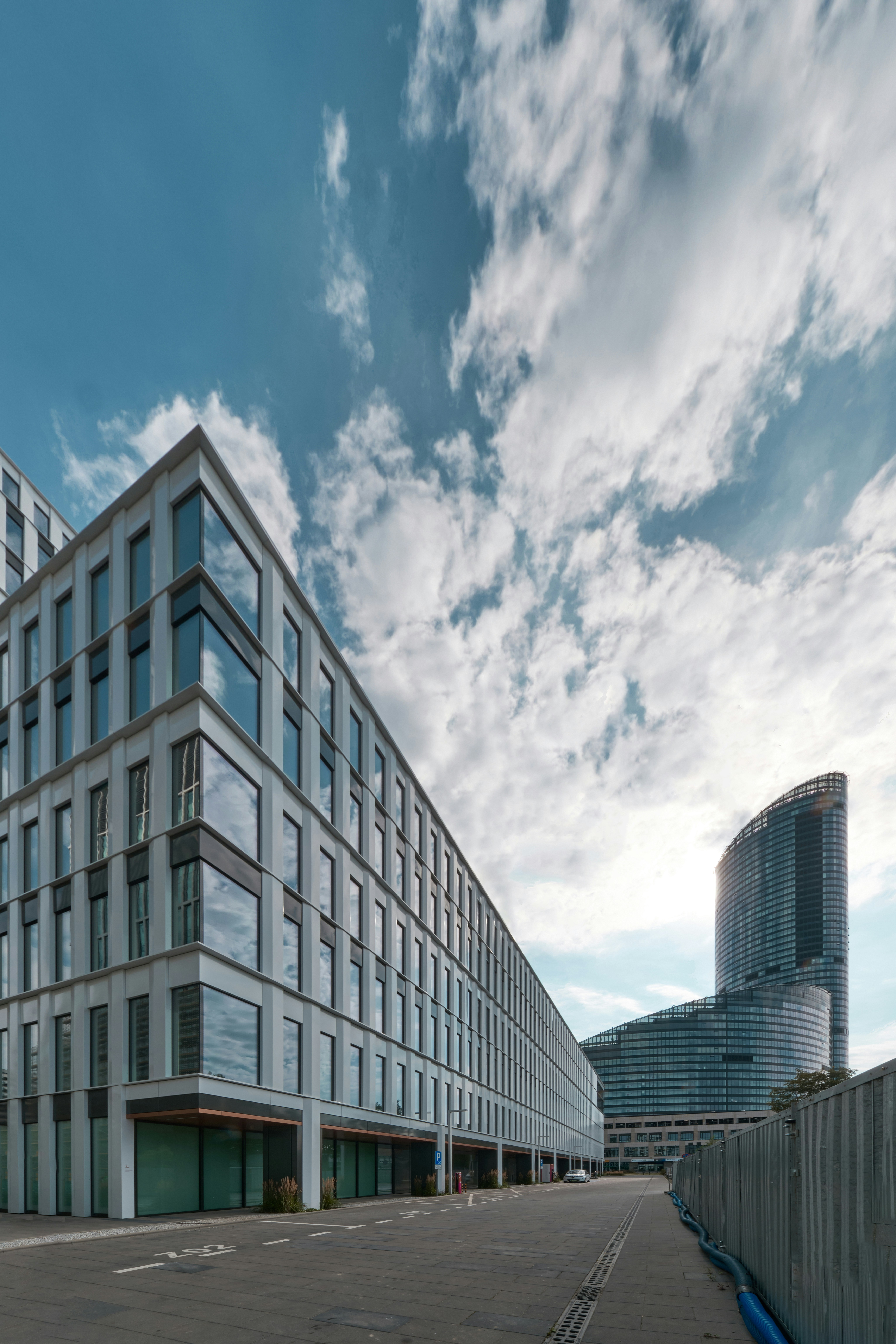 a large building sitting next to a parking lot
