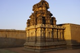 Ancient temple carvings bathed in warm sunlight in Hampi.