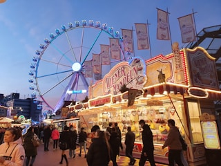 Photo of a vibrant local fair with food stalls and happy visitors.