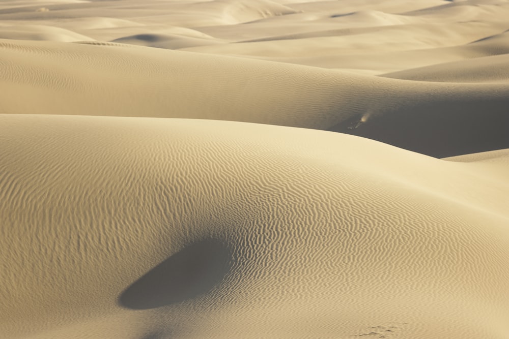 a view of a desert with sand dunes