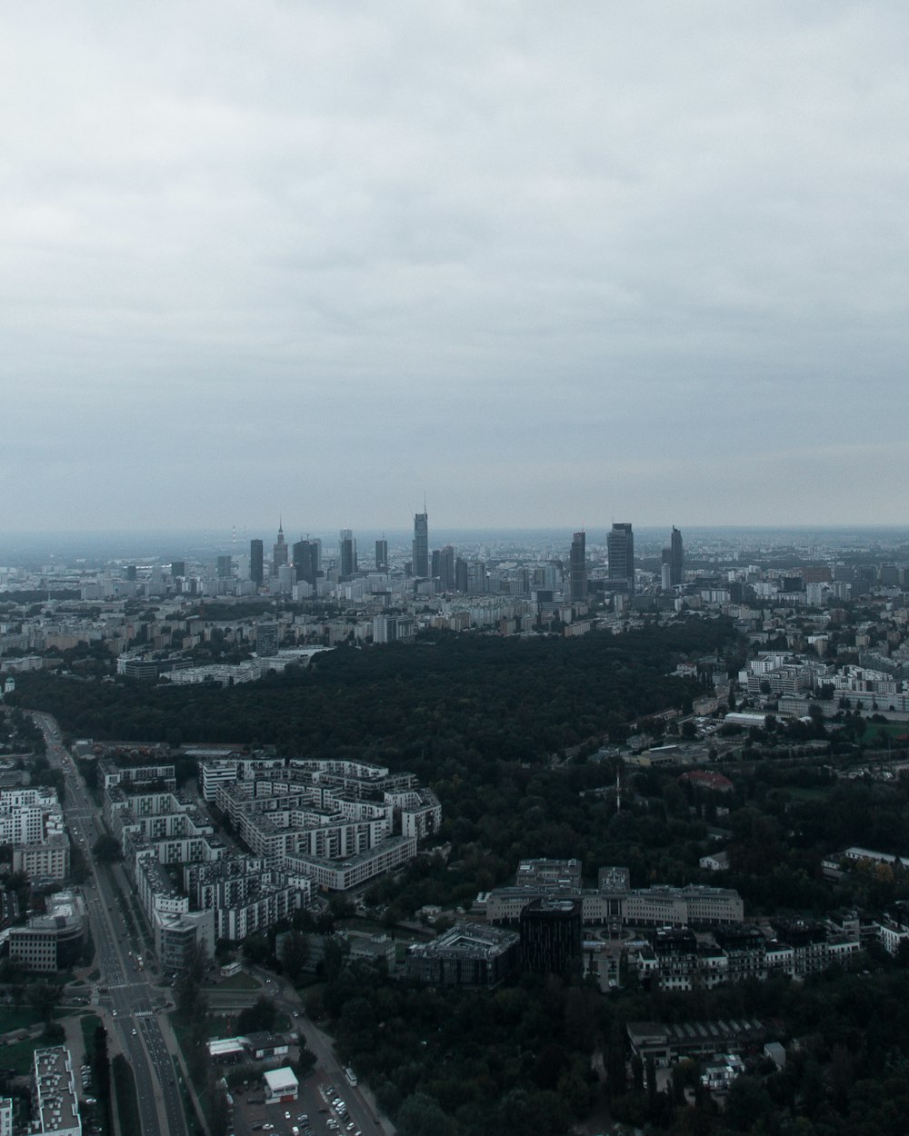 an aerial view of a city with tall buildings