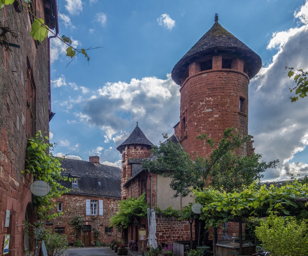 an old brick building with a tower on top