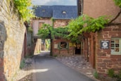 A quiet village path in the Luberon with subtle paintings installed along the way.