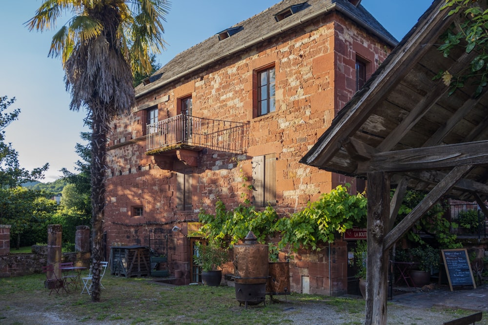 an old brick building with a balcony and balconies