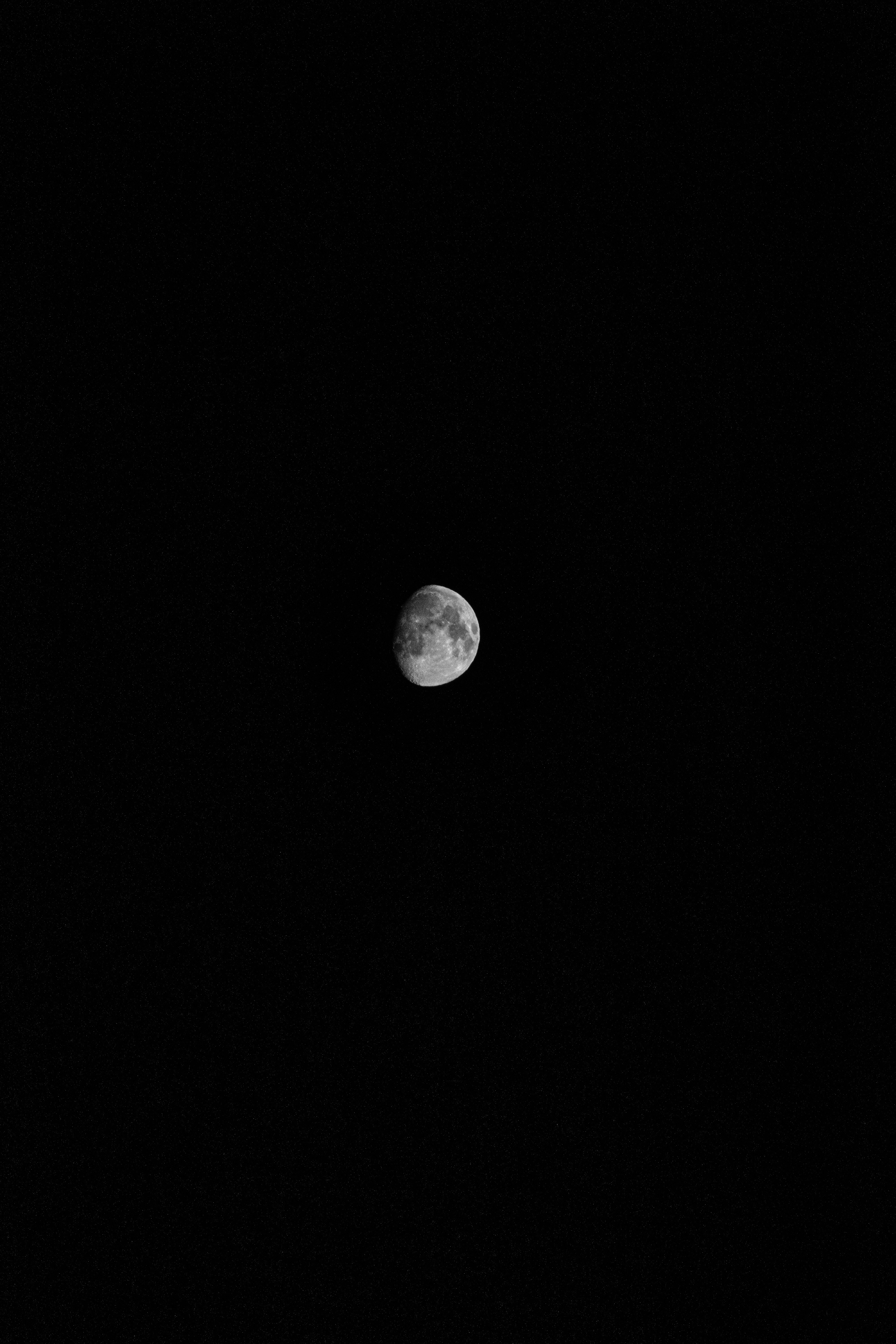 a black and white photo of the moon
