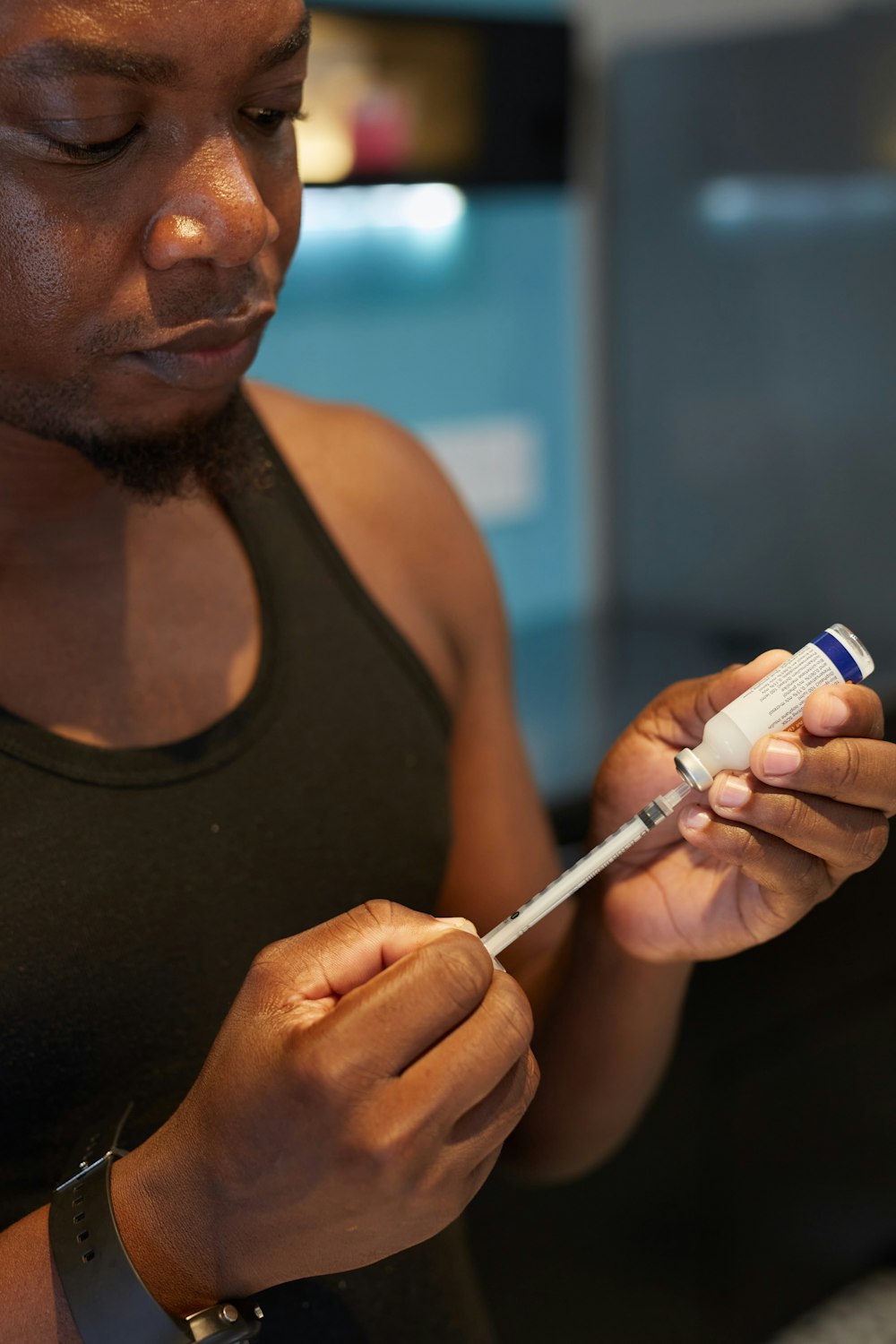 a man is holding a toothbrush in his hand