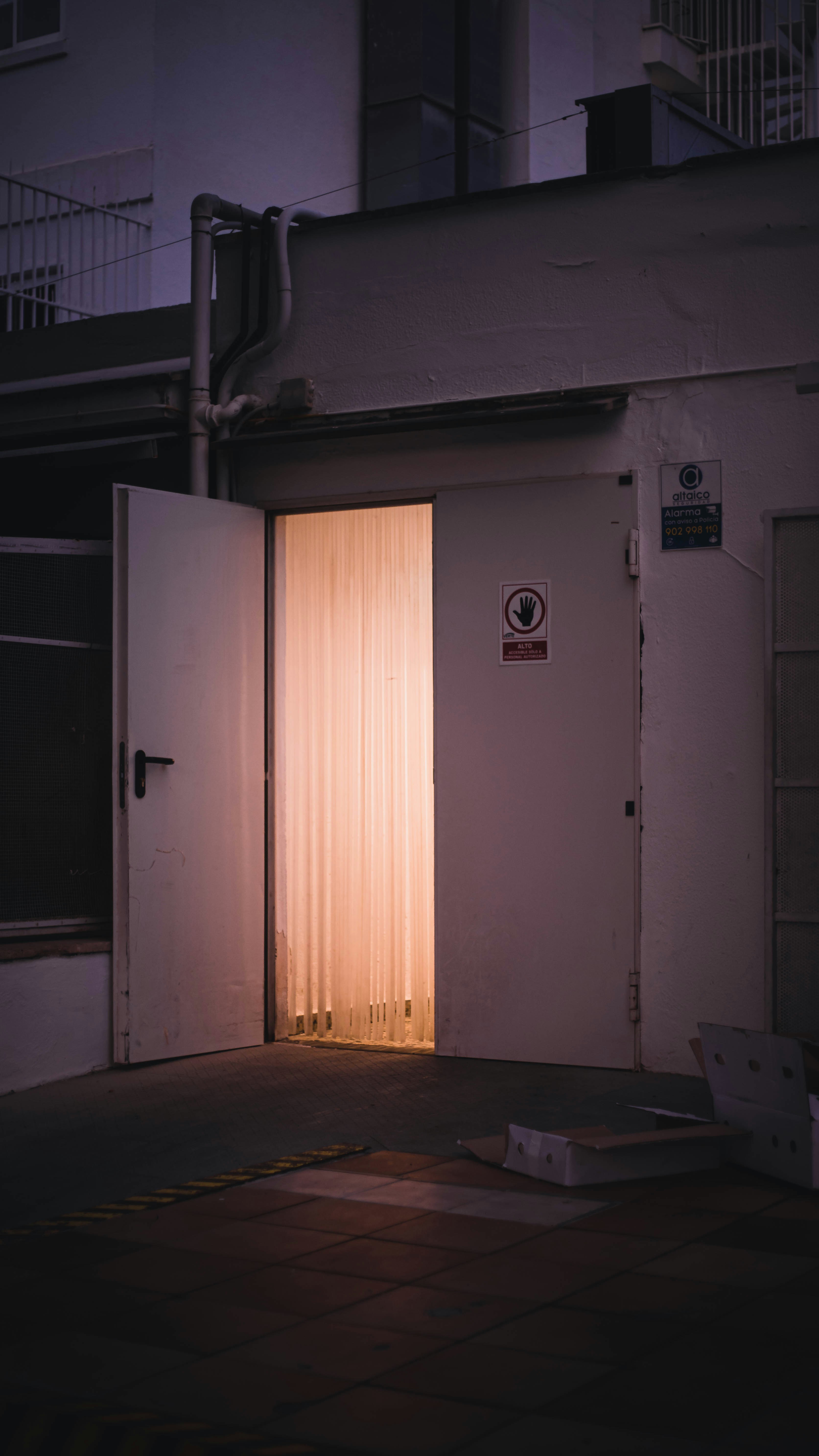 an open door with a light shining through it