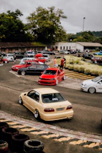 a parking lot filled with lots of parked cars