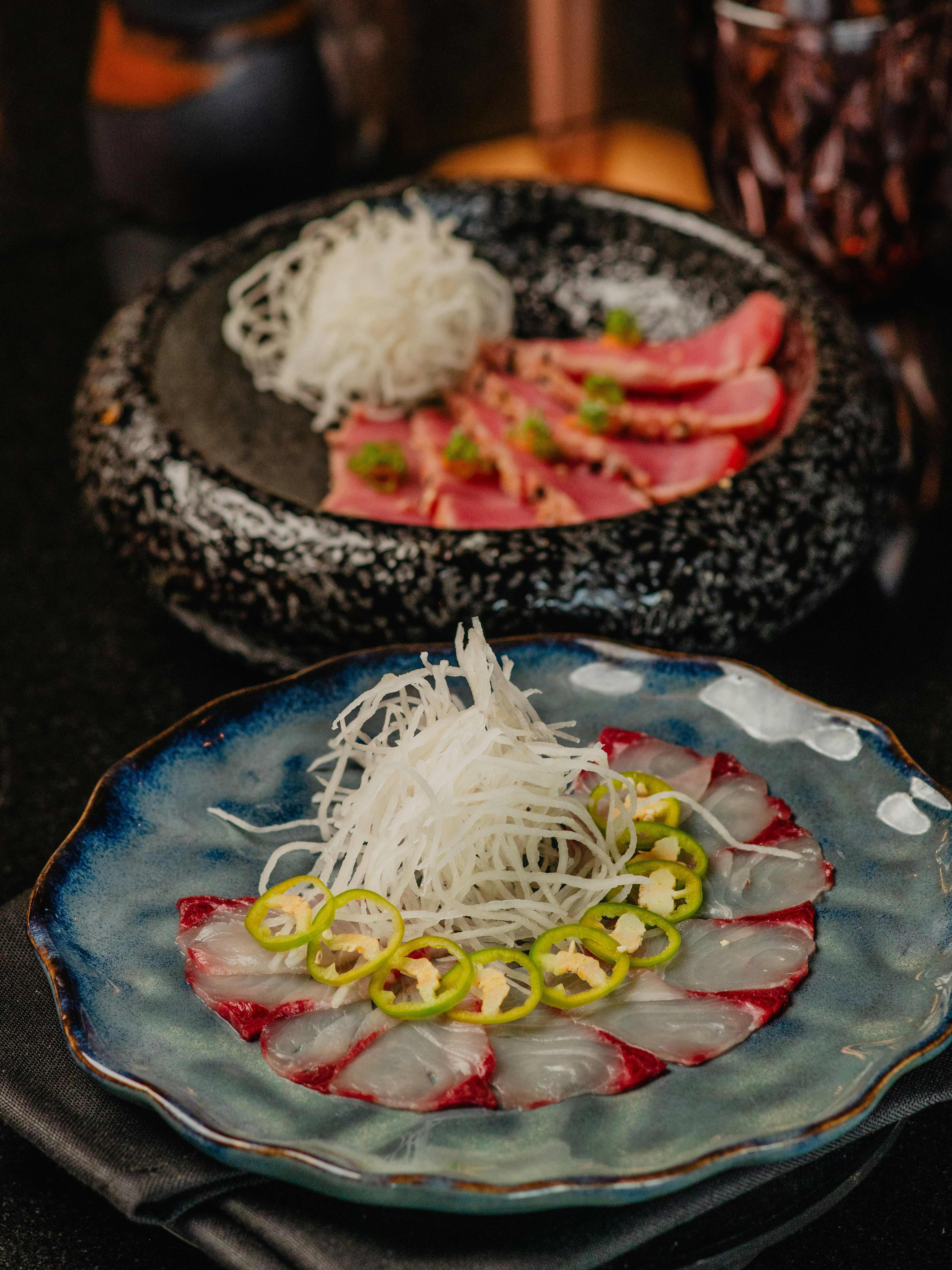 two plates of food are sitting on a table