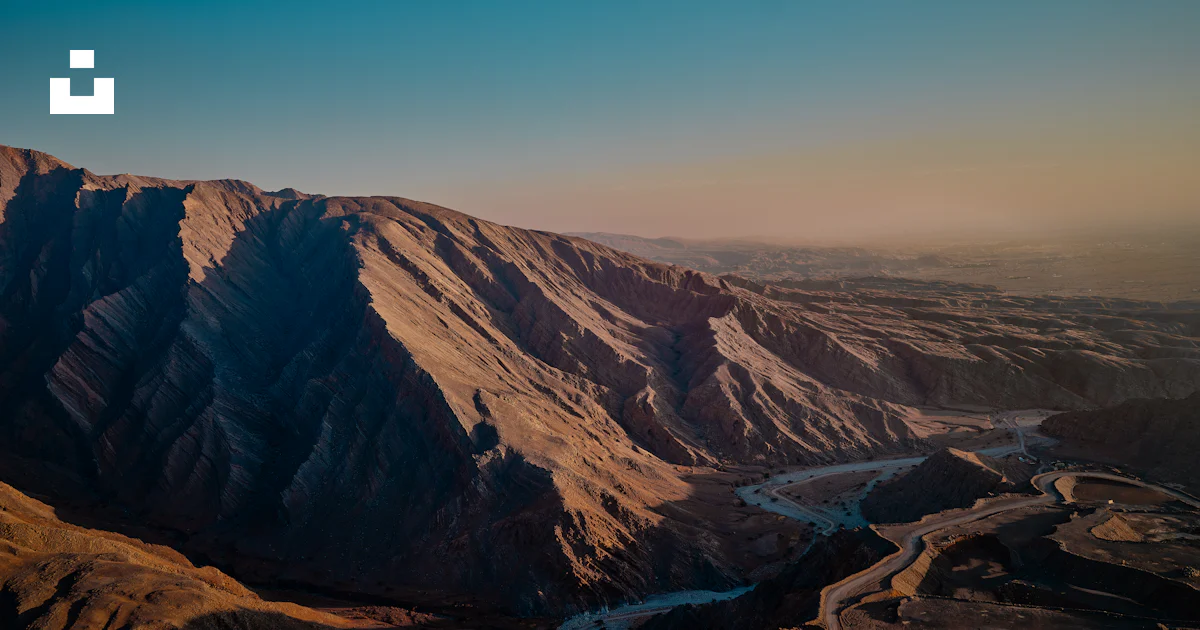 Arabian Ranges Photos An aerial view of a mountain range with a river running through it ...